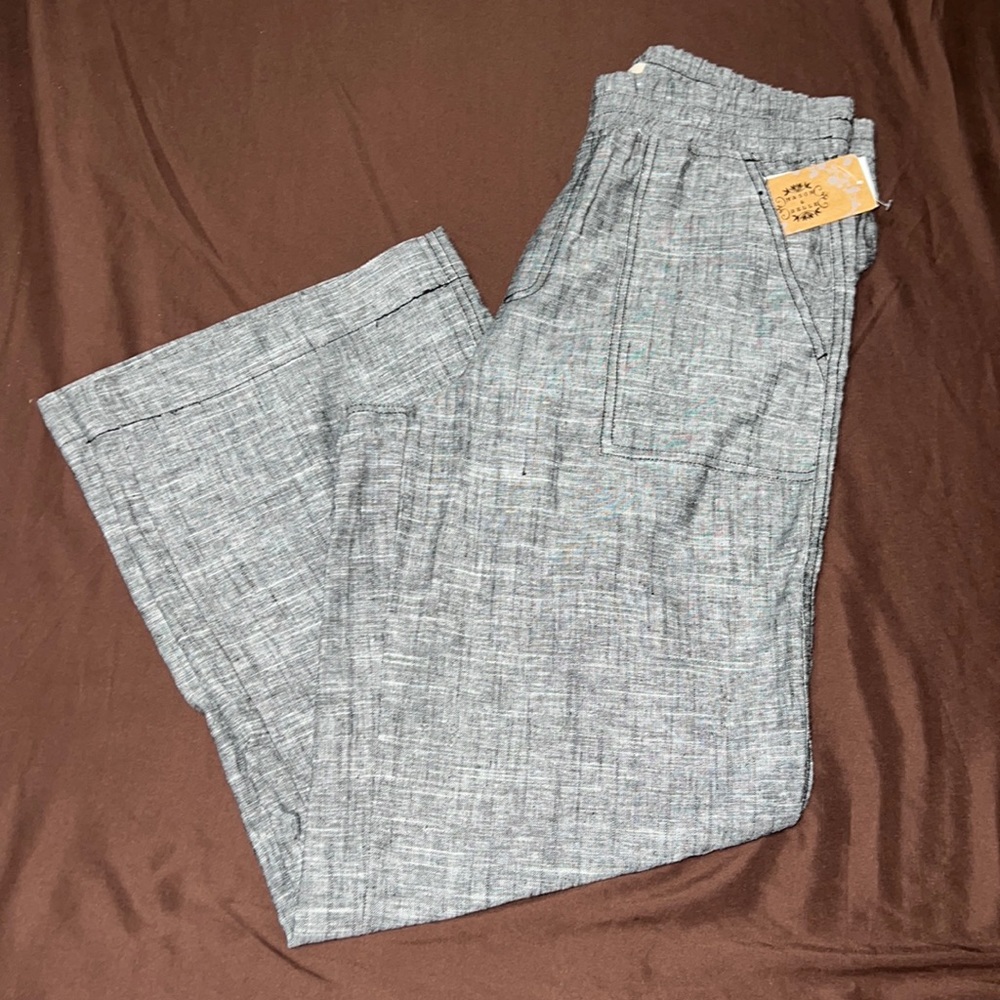Gray pants, not stretchy, pack and front pockets, brand new!